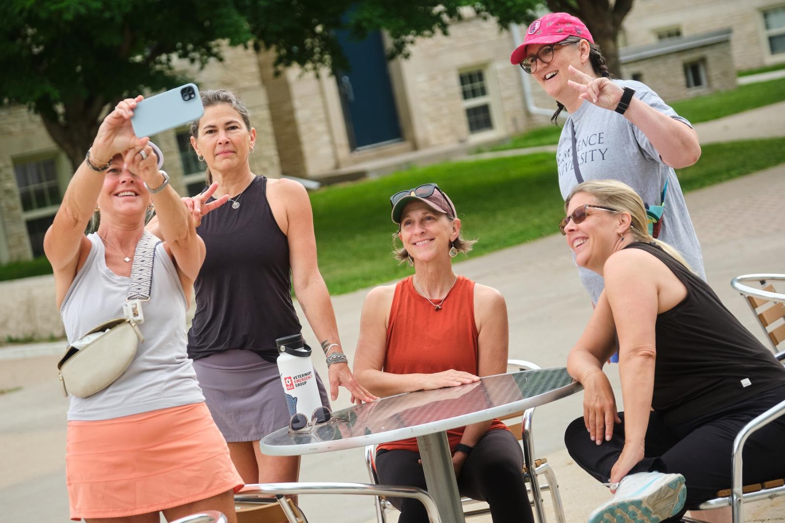 Lawrence alumni take photos as they reconnect on campus.