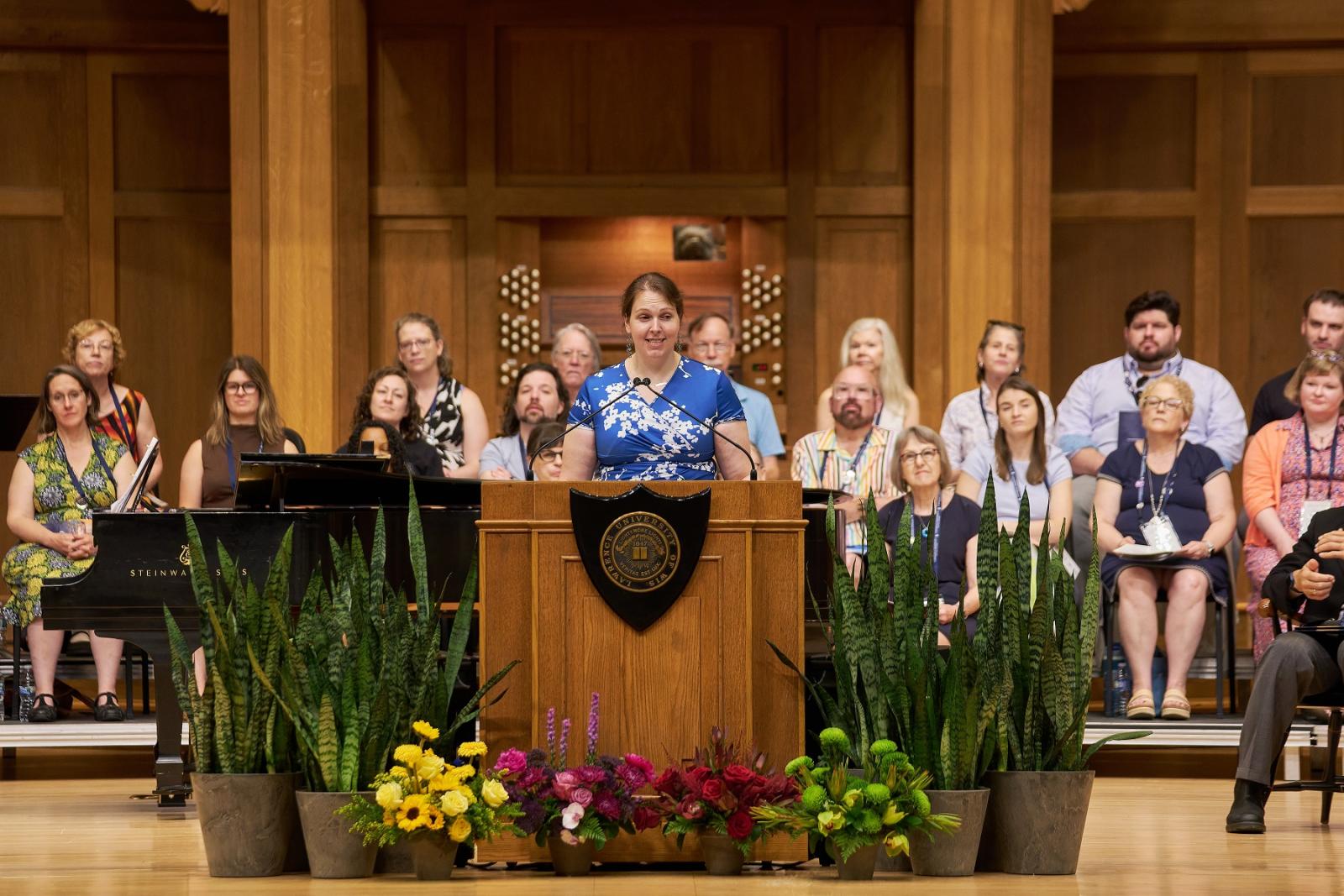 Margaret “Maggie” Schmidt ’12 addresses alumni at Reunion Convocation in Memorial Chapel.