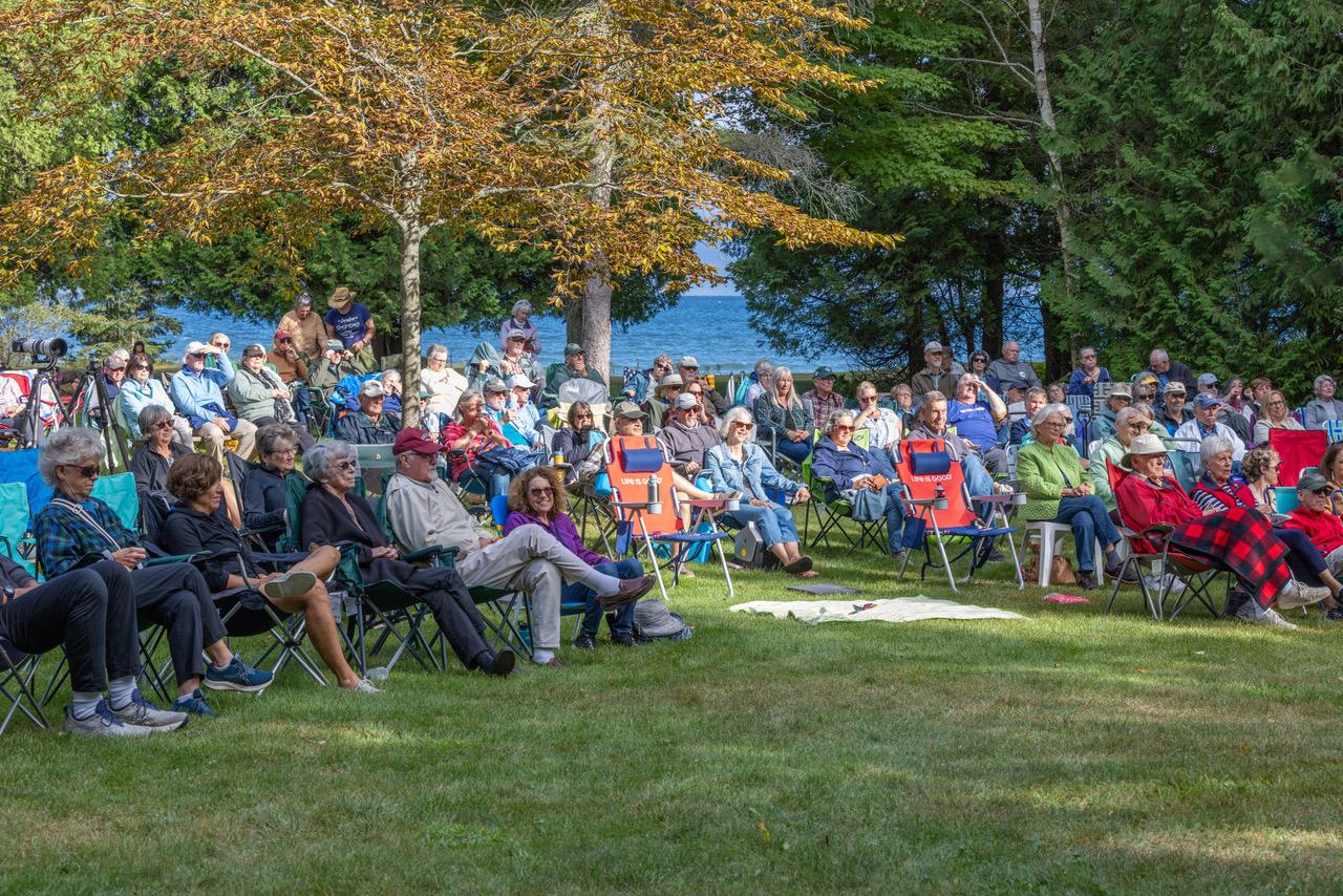 A crowd listens to the music by Lake Michigan