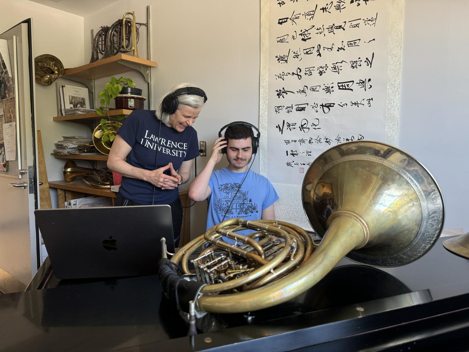 Ann Ellsworth and Leo Rodda listen to their edited tracks