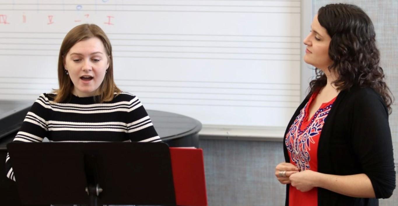 Esteli Gomez works with a vocal arts student