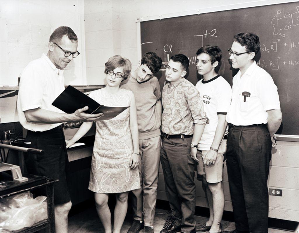 Professor Allen West on left instructs students in a classroom