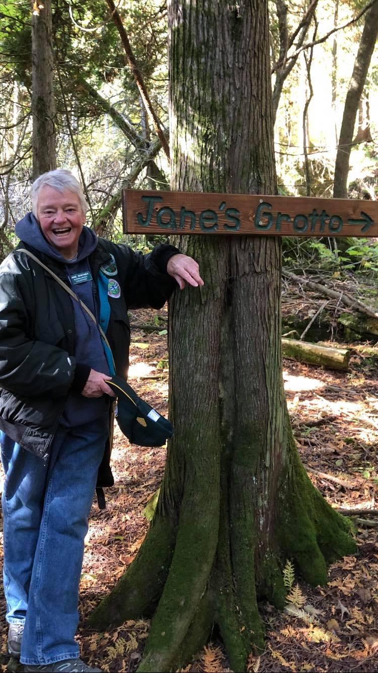 Jane leads the way to her Grotto on the shore