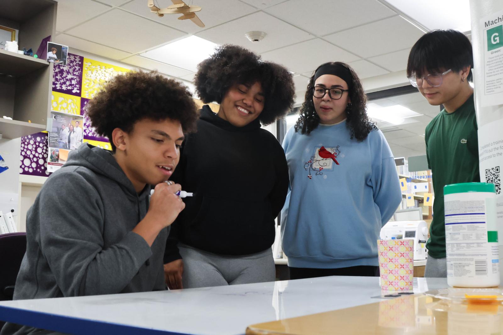 Students explore ideas in the Makerspace, led by Lee Gobenciong (right). November 2025. Photo by Adrian Stancil-Martin '28