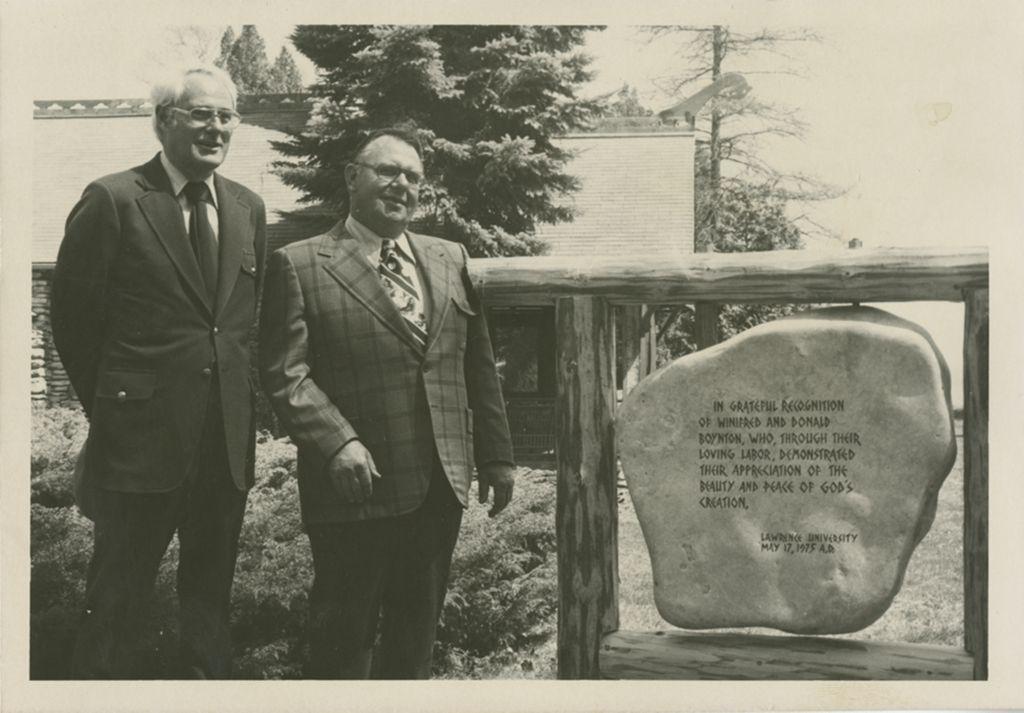 Tom Smith and Kenneth Zach stand in front of Bjorklunden dedication stone 1975