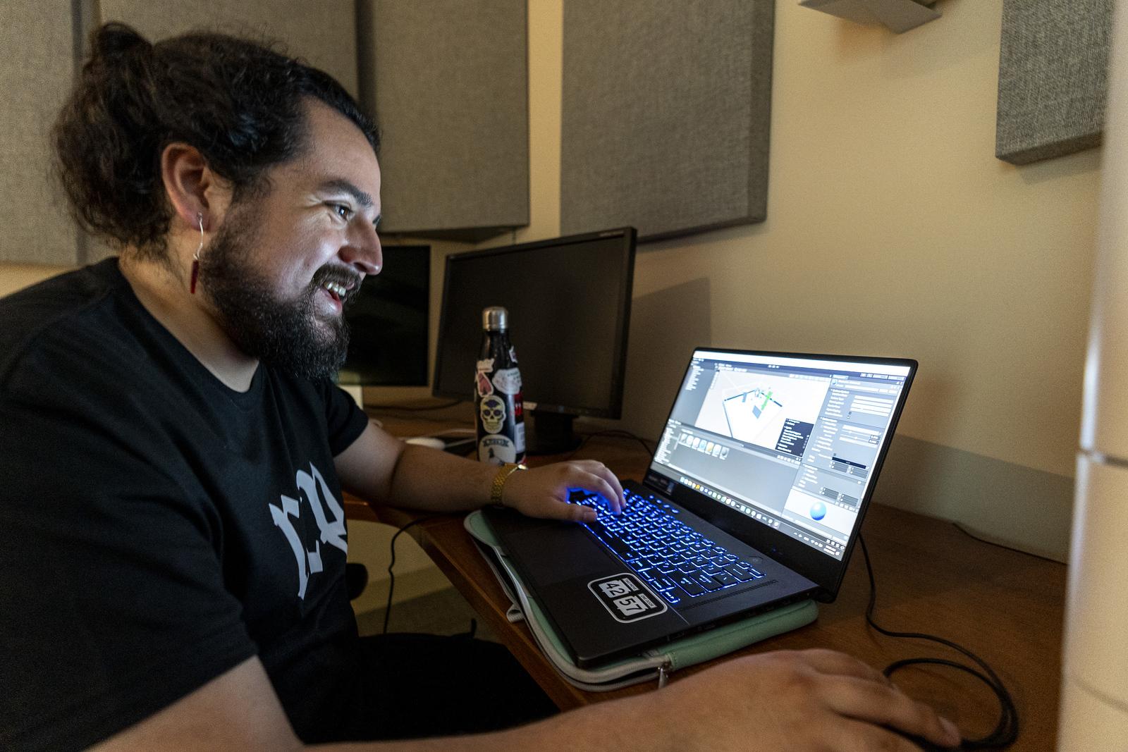 A person sitting at a desk with a computer