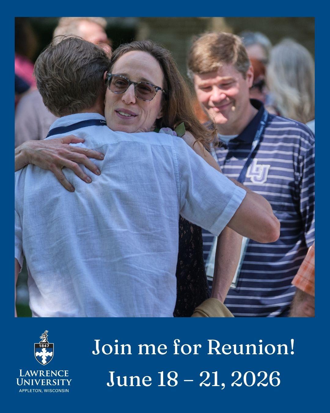 Reunion guests share a hug