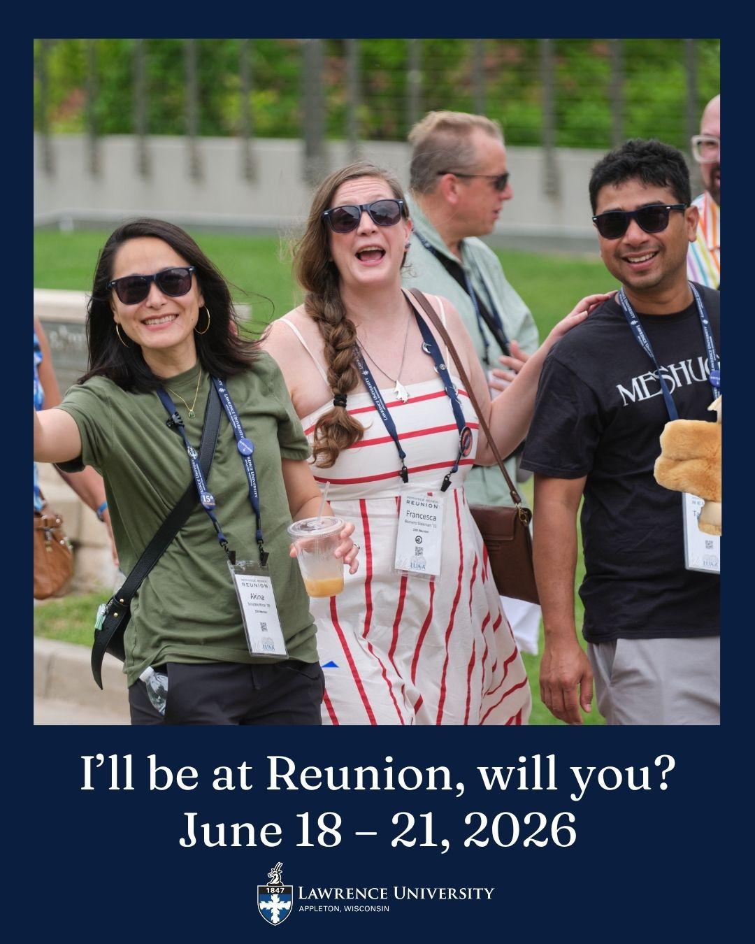 Alumni at reunion smile and wave