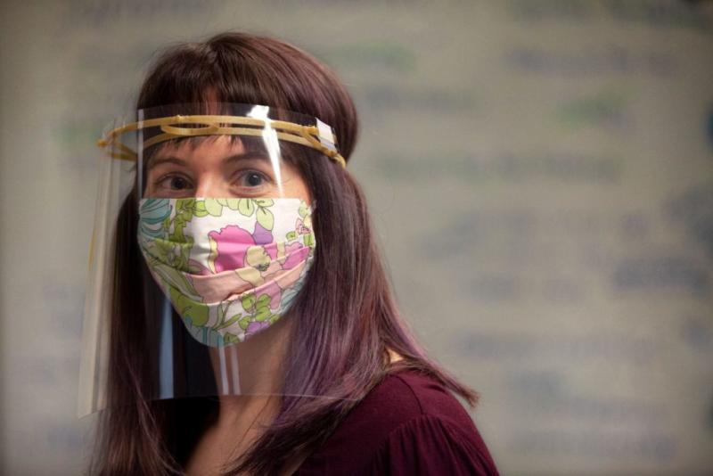 Angela Vanden Elzen models one of the face shields built with 3D printers in Lawrence University’s Makerspace