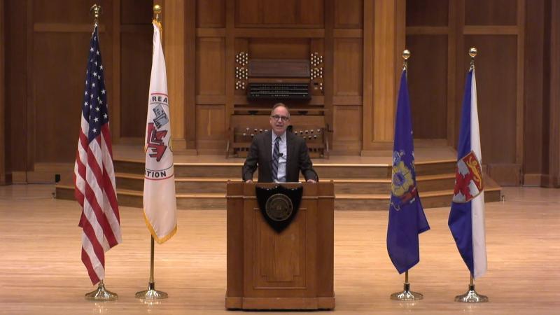 President Mark Burstein delivers his Matriculation Convocation address virtually from the Memorial Chapel stage.