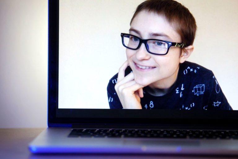 Jojo Maier is shown smiling on a laptop screen.