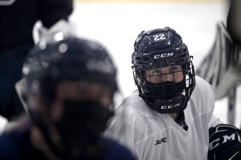 Lauren Askenazy, wearing a hockey uniform, plays in a hockey game.