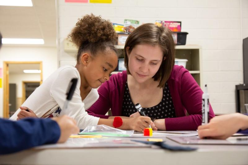 Michelle Gibson works with a student at Appleton’s Lincoln Elementary School.