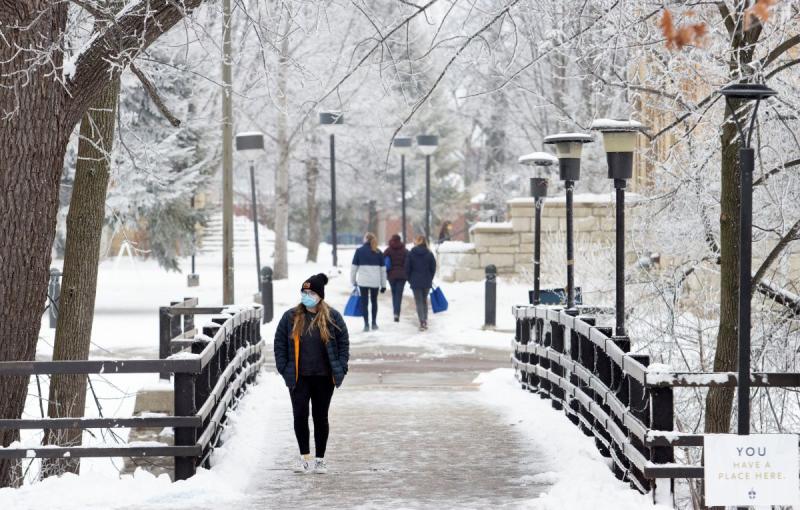 Lawrence students walking around the snowy campus