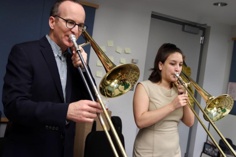 Tim Albright, assistant professor of music works with Allie Goldman ’21 during a trombone teaching session in Shattuck Hall