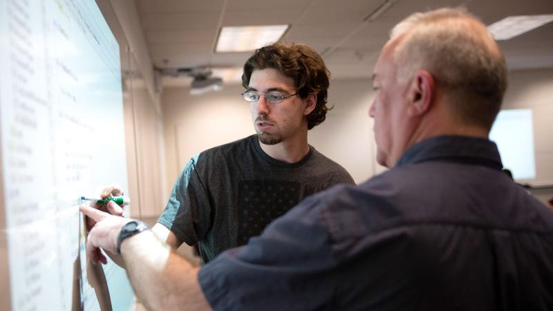 Computer Science professor teaches a computer science class