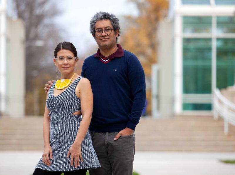 Horacia Conteras, and his partner, Natali Herrera-Pacheco stand together outside Lawrence's Conservatory