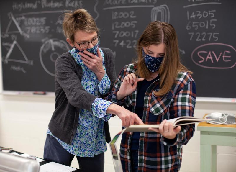 Marcia Bjornerud, Walter Schober Professor of Environmental Studies and Professor of Geosciences, works with Madeline Taylor ’23 during Hot Rocks