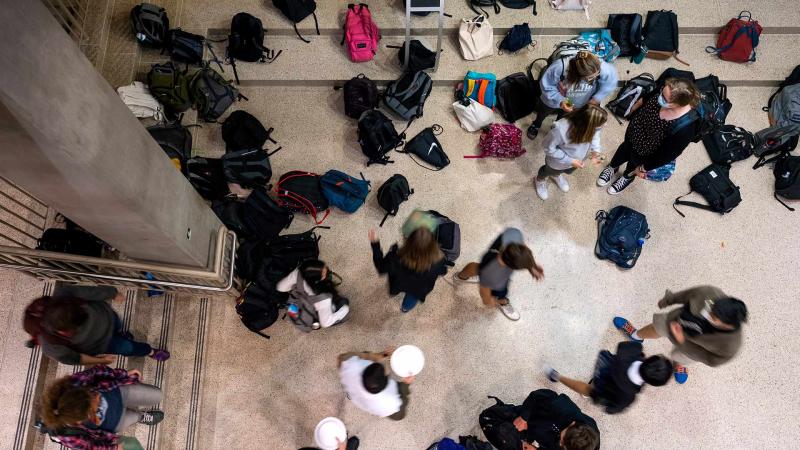 Students drop off and pick up their bags outside of Andrew Commons