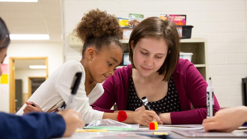 Michelle Gibson ’17 works with students in her second-grade classroom at Appleton’s Lincoln Elementary School.