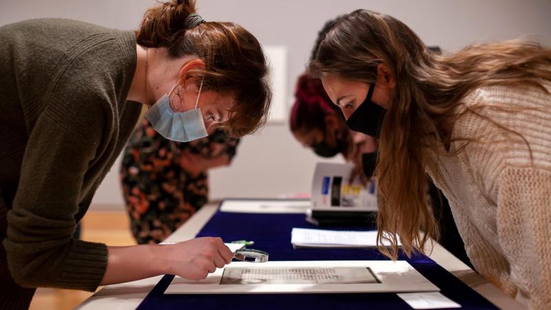 students take a closer look at a manuscript