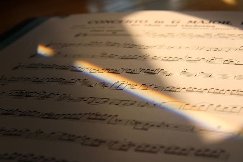 reflected light shining on sheet music