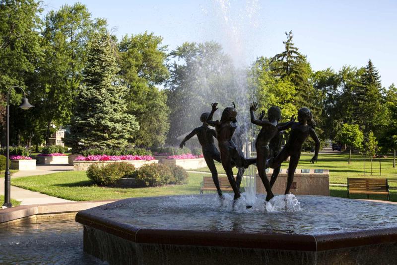 bronze statues of children in fountain City Park, Appleton WI