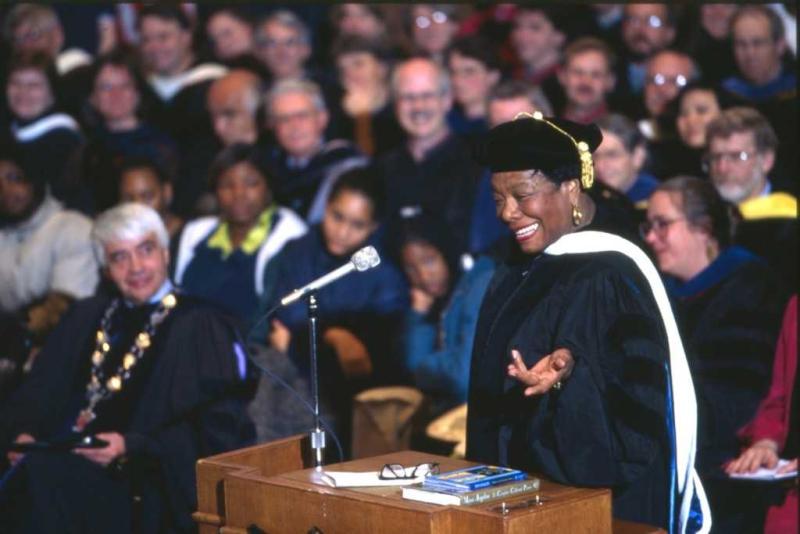Maya Angelou gestures with her left hand while speaking at the podium during a 1997 convocation.