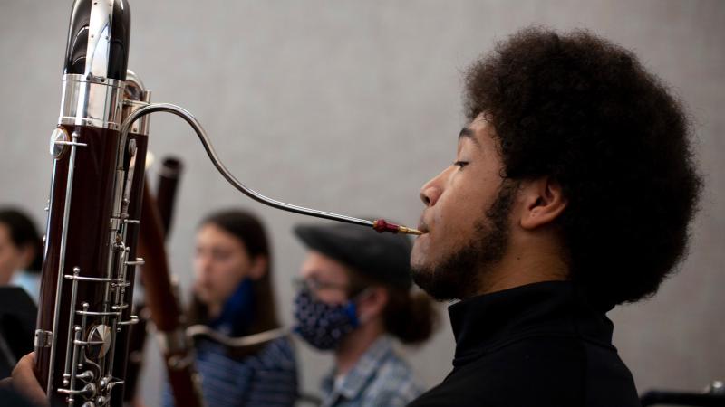 Student plays bassoon in class