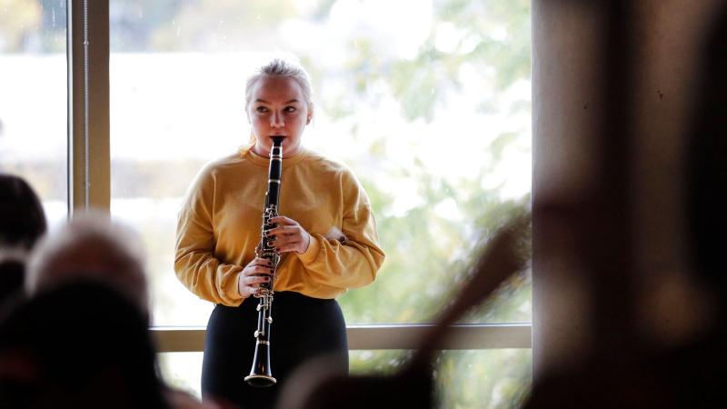 Student playing clarinet in Warch Campus Center