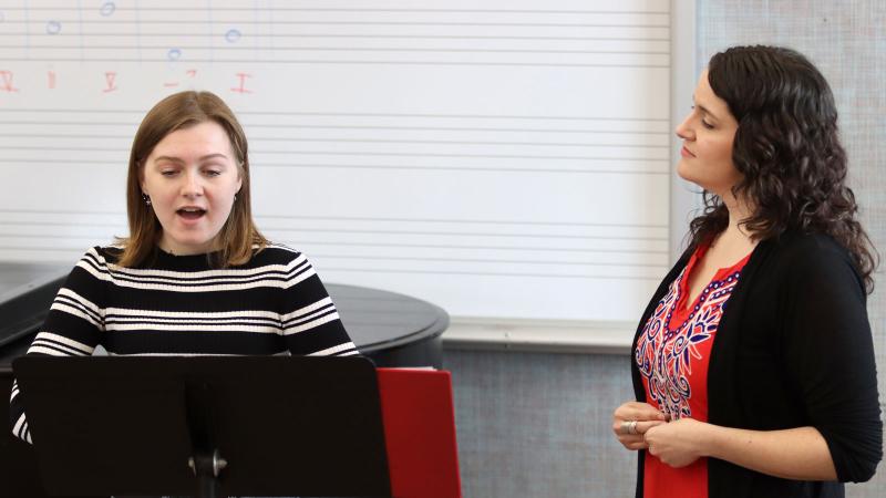 Estelí Gomez, Assistant Professor of Music, works with student during a studio class