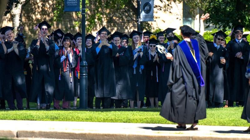 Students cheer as they line up for 2022 Commencement