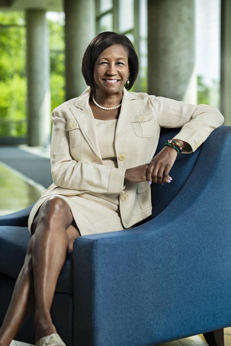 Laurie Carter sitting on a blue chair