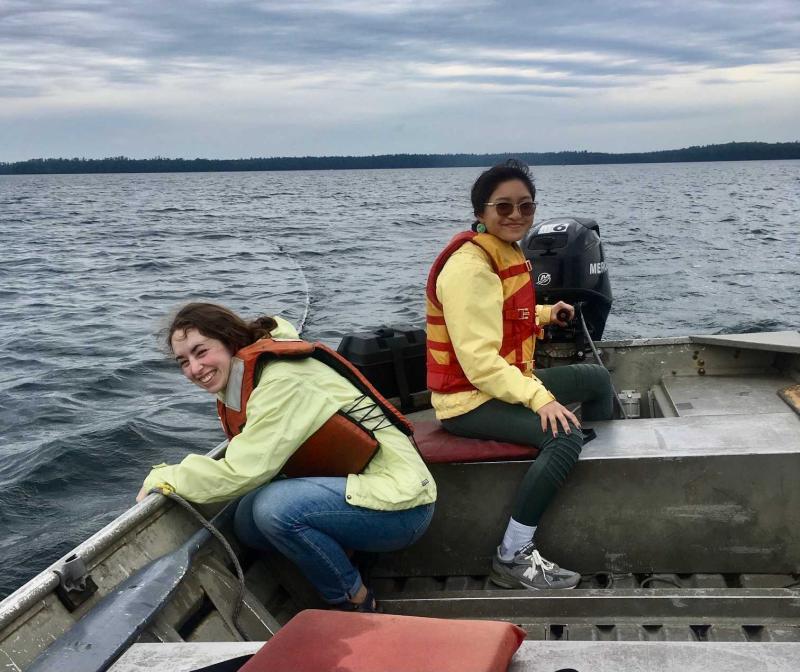 Eleanor Meng and Reese Lavajo cruise Trout Lake in a small boat as do research.  