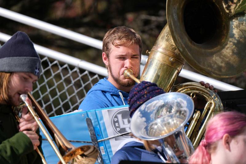 Horns are played by students at last year's Blue & White Weekend tailgate party. 