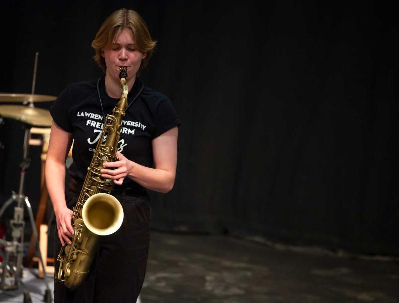 Lucy Croasdale plays the saxophone in Cloak Theater during Jazz Weekend.
