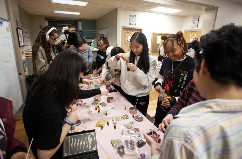 Students lineup to make candles at a Candles for Cuties event Wednesday in the Diversity & Intercultural Center.