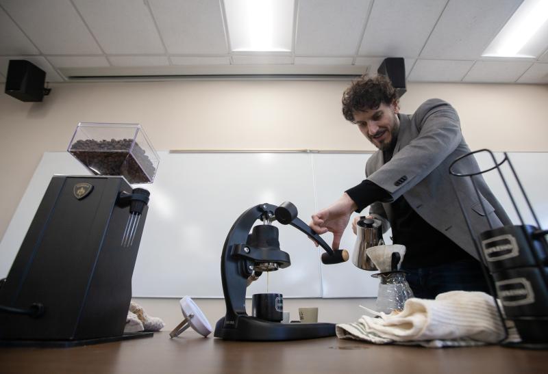 Greg Milano shows an espresso technique during class.