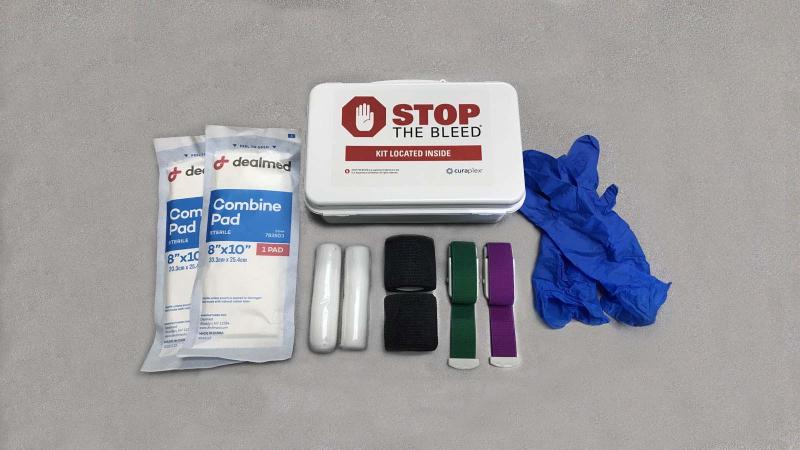 Stop the Bleed Kit contents - latex-free gloves, 2 quick-release tourniquets, 2 wraps, 2 gauze rolls, and 2 combine pads 