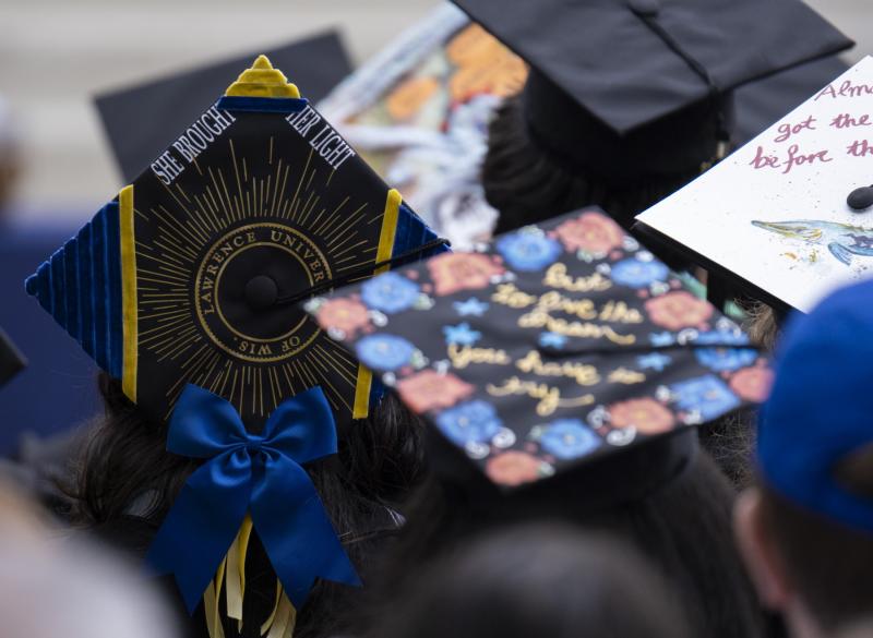 Close up of decorated graduation caps.