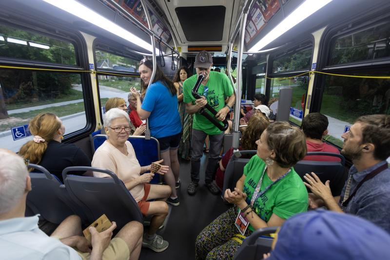 Brian Pertl and other members of the Music Education Team engage with passengers on the Mile of Music Bus.