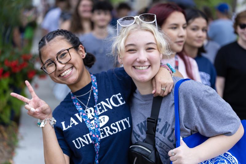 First-year students smile for the camera as they prepare to walk to the President's Welcome.