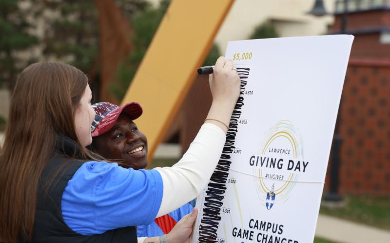 Students and staff chart Giving Day Game Changers. 