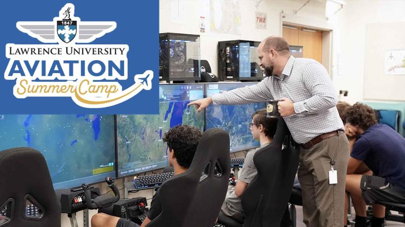 FVL instructor showing students how to use flight simulators