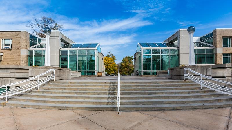 Steps leading towards the glass exterior of Shattuck Hall of Music.