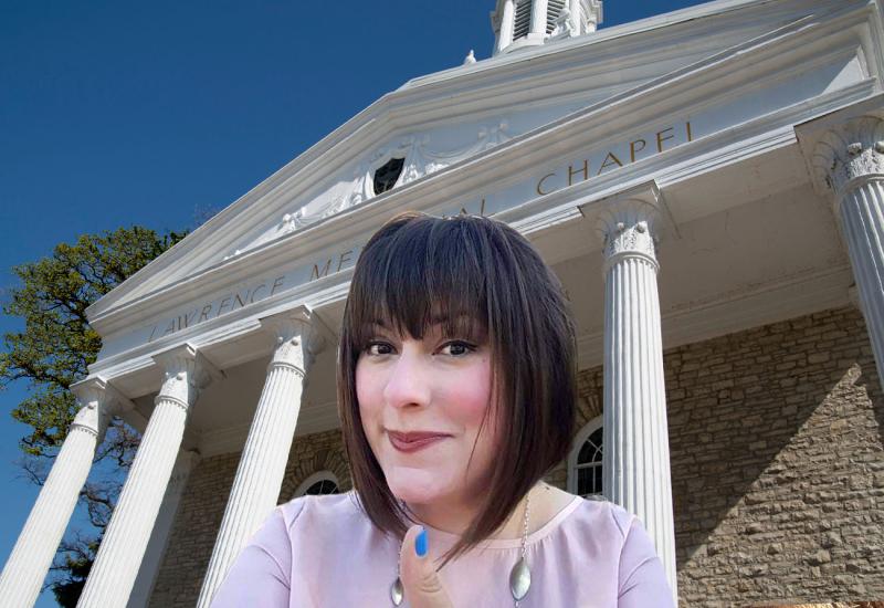 Annelise DeDeimer in front of Lawrence Memorial Chapel