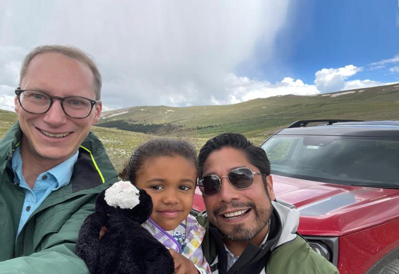 William Burrow '00 and husband Nathan Heffel '03 with daughter