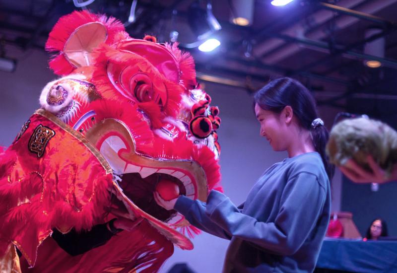 Lunar New Year Student feeding dragon