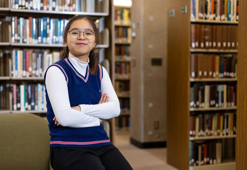 Cailey Cao Le poses for a portrait in Mudd Library.