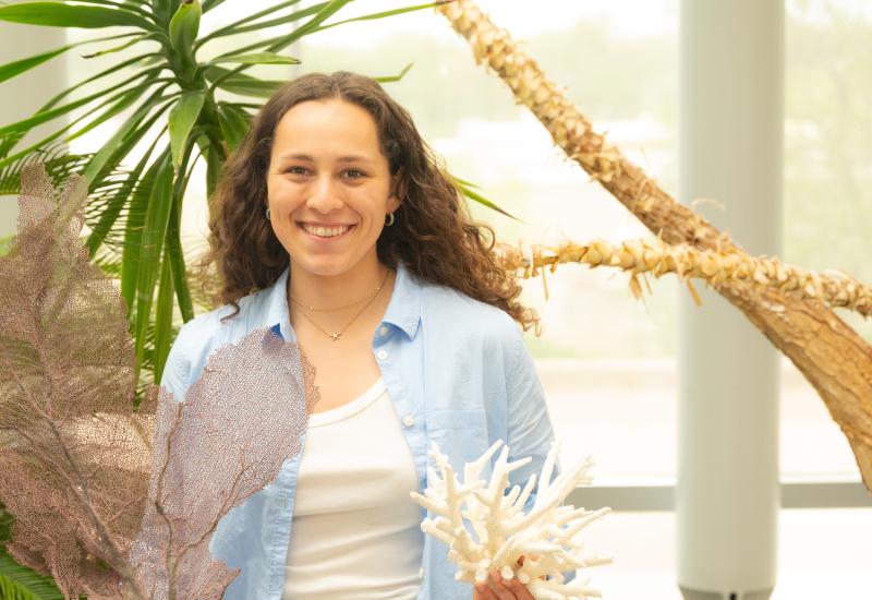 Emma Moya poses with some of the coral samples found in Bonaire.